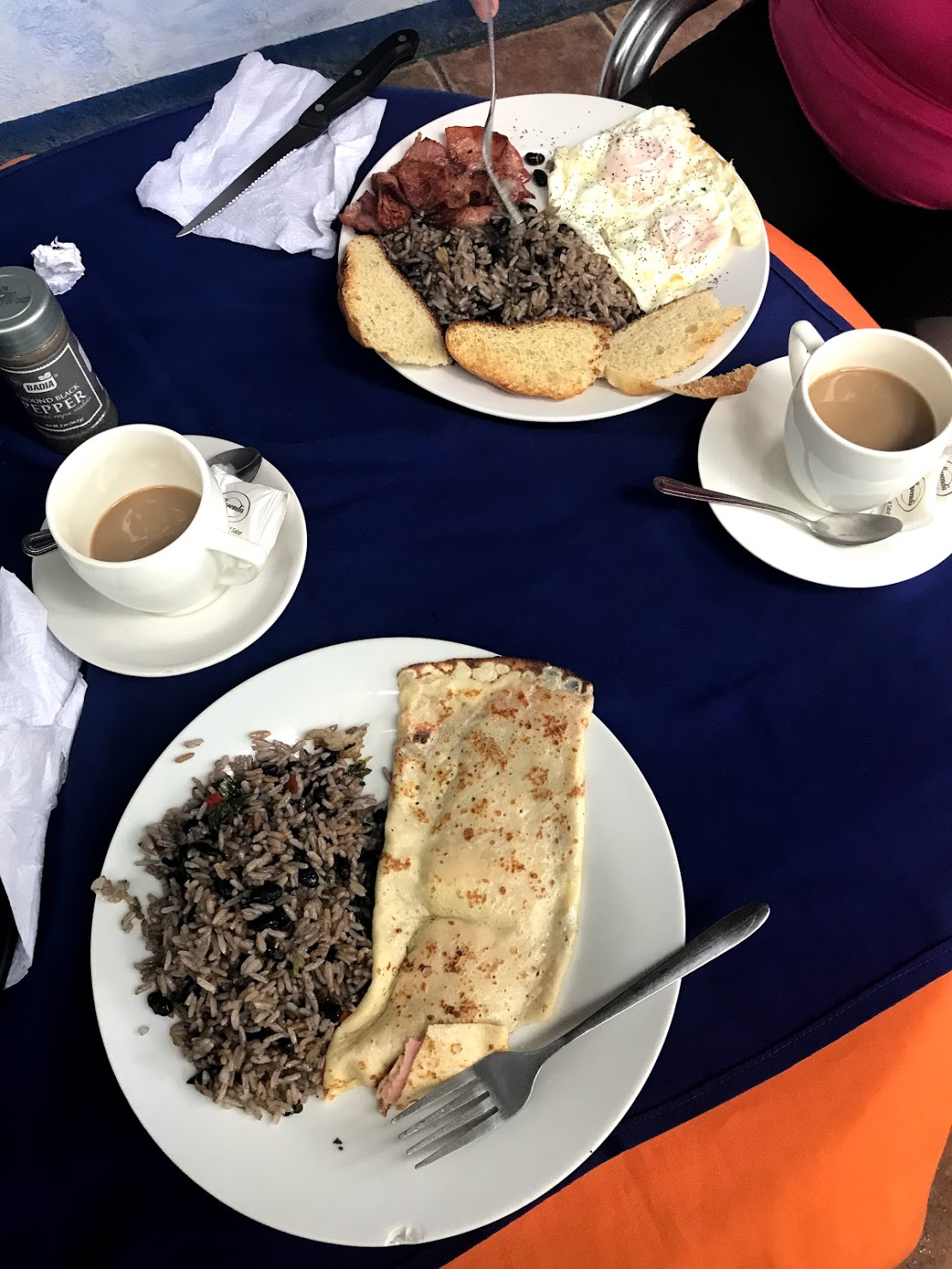  Here is a shot of breakfast one morning in Montezuma (so cheap!) where I enjoyed a ham and cheese crepe and Shelby had eggs and toast. Gallo Pinto is served with every meal in Costa Rica, even breakfast. It means “spotted rooster” in Spanish and is said to have gotten its name from the speckled appearance that results in cooking the rice with the beans. 